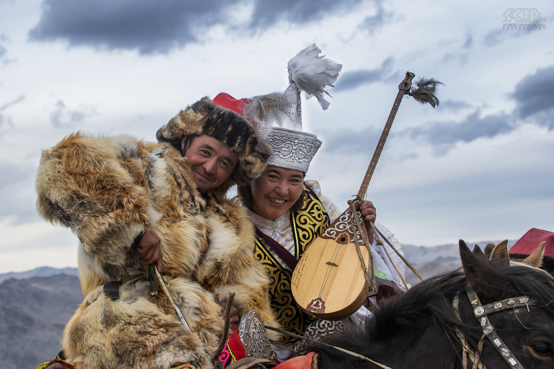 Ulgii - Golden Eagle Festival - Couple A nice couple of Kazakhs, both in their traditional costume. Stefan Cruysberghs